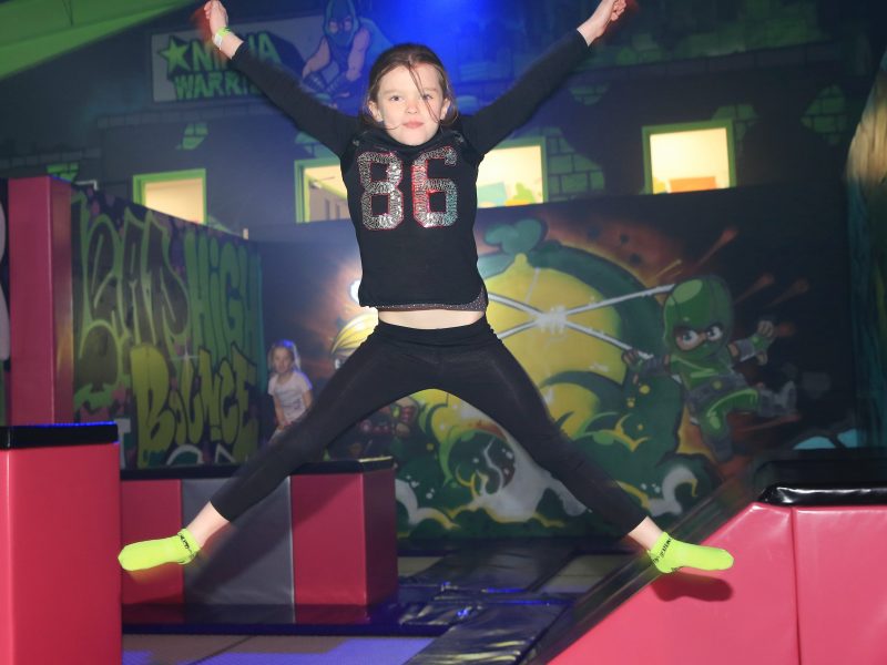 Child jumping for joy at Flip Out